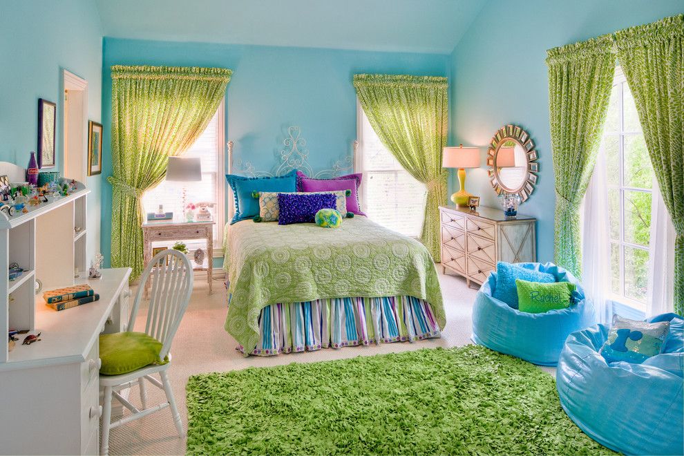 Green curtains in a children's room with blue walls