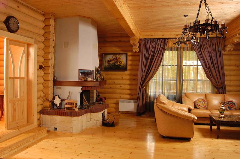 The interior of the living room in a country house made of logs