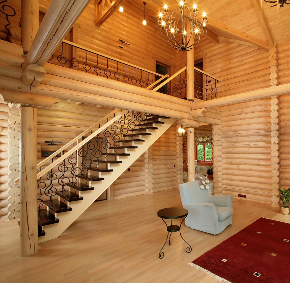 Staircase in the lobby of a log house