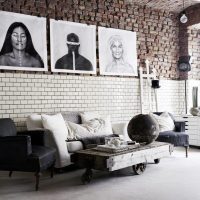 Decorating a brick wall with black and white photographs