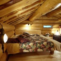 Low ceiling bedroom interior in a log house