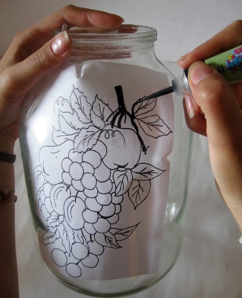 Using a stencil to decorate a glass jar