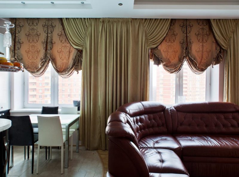 Italian curtains made of thick material in the living room of a city apartment