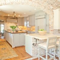 Bright kitchen with brick arch