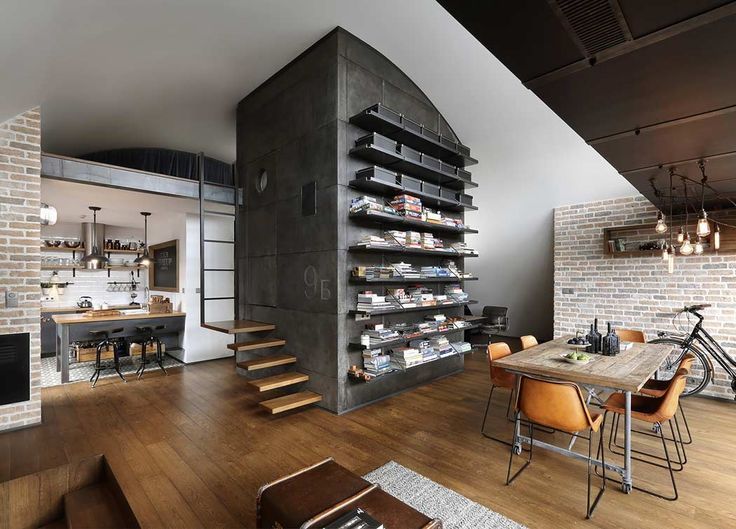 Open shelves on a gray column in the middle of the living room