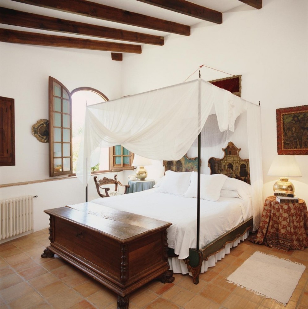 Four-poster bed in a bright bedroom
