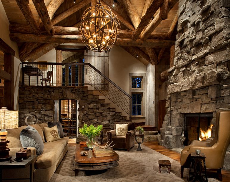 Living room with a large fireplace made of natural stone