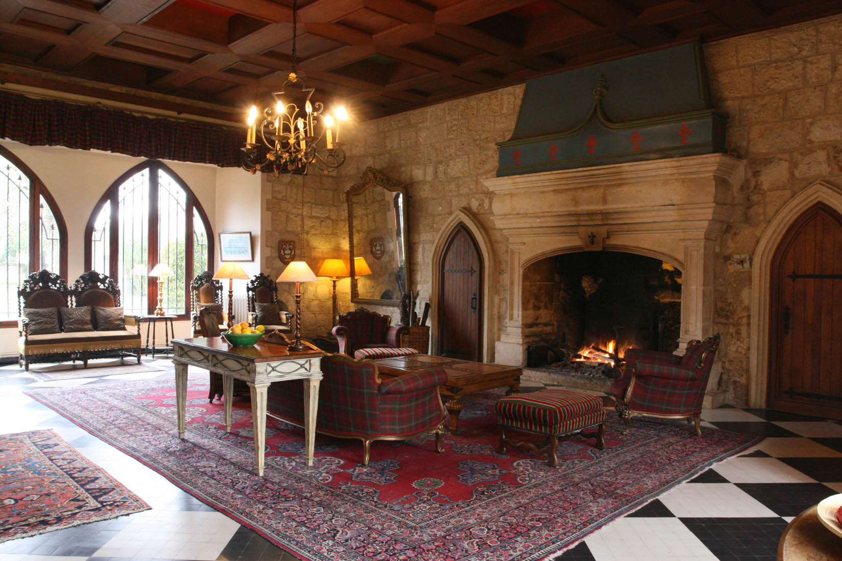 Rest area in front of the fireplace in the living room in the castle style