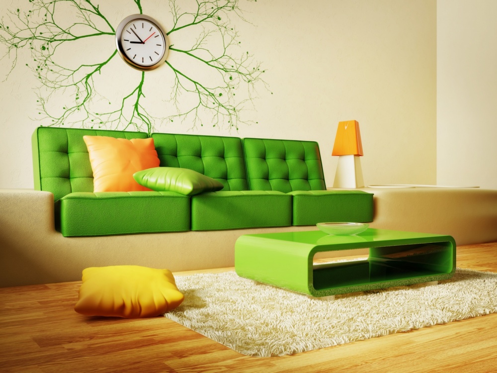Orange pillow on a green sofa