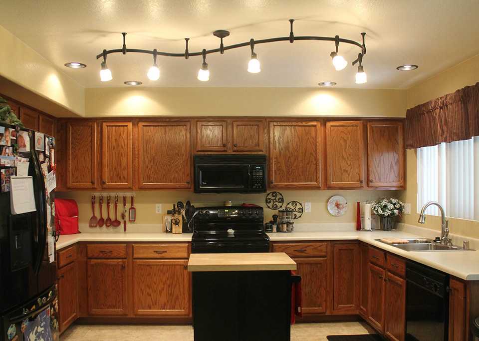 Kitchen lighting with brown facades