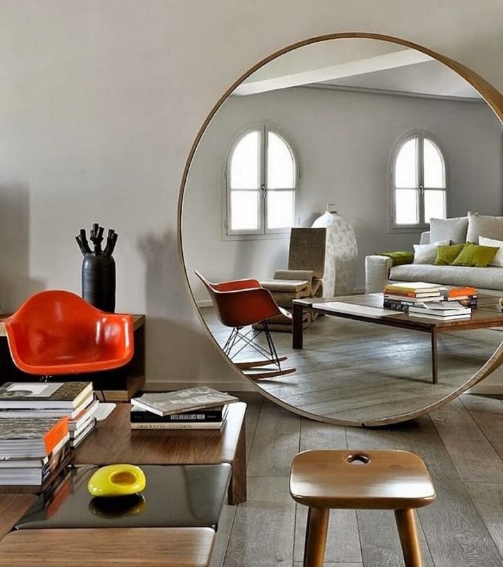 Large round mirror on the living room floor