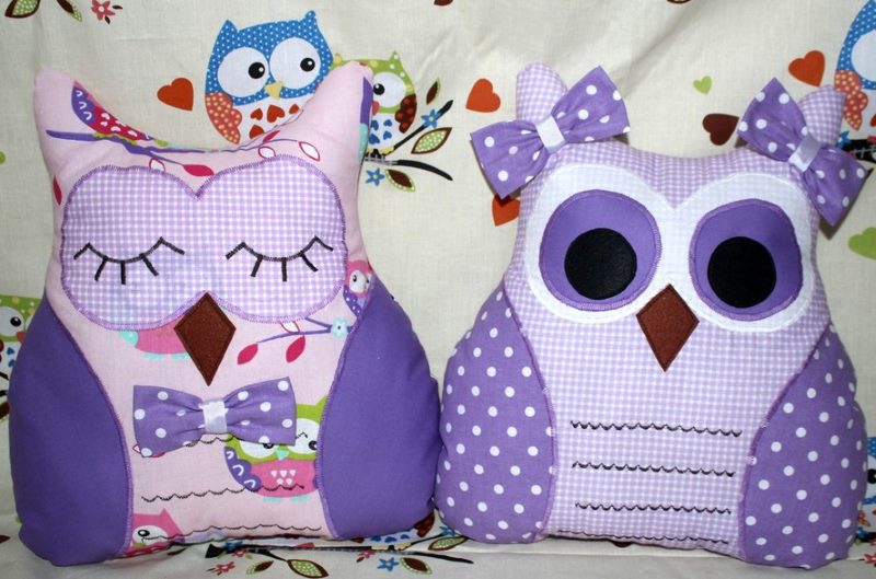 Two decorative pillows in the form of owls