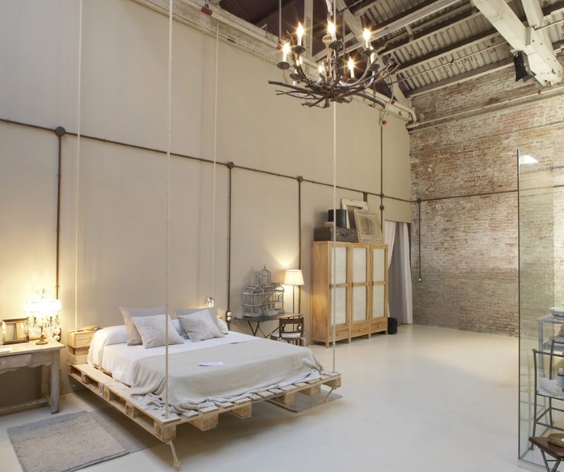 Spacious loft bedroom with home-made furniture