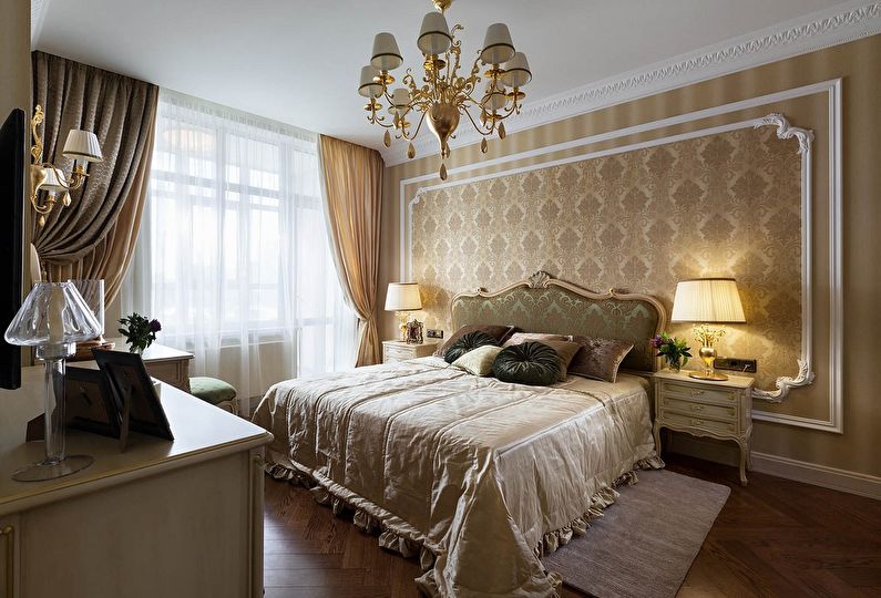Gilded chandelier on the ceiling of a classic bedroom