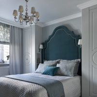 Bed with high headboard in the spouses bedroom