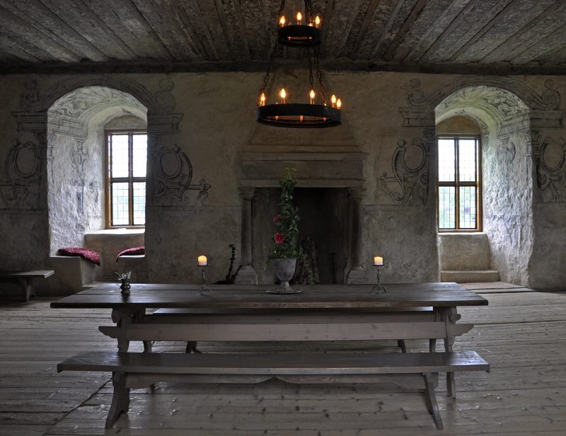 Table with benches in the interior of a medieval style