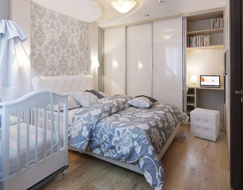 Interior of a small bedroom with a baby bed