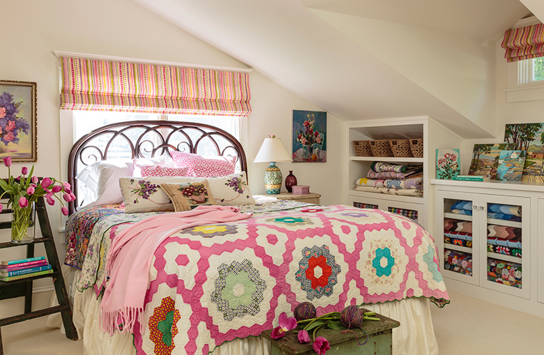 Colorful bedspread in the attic bed