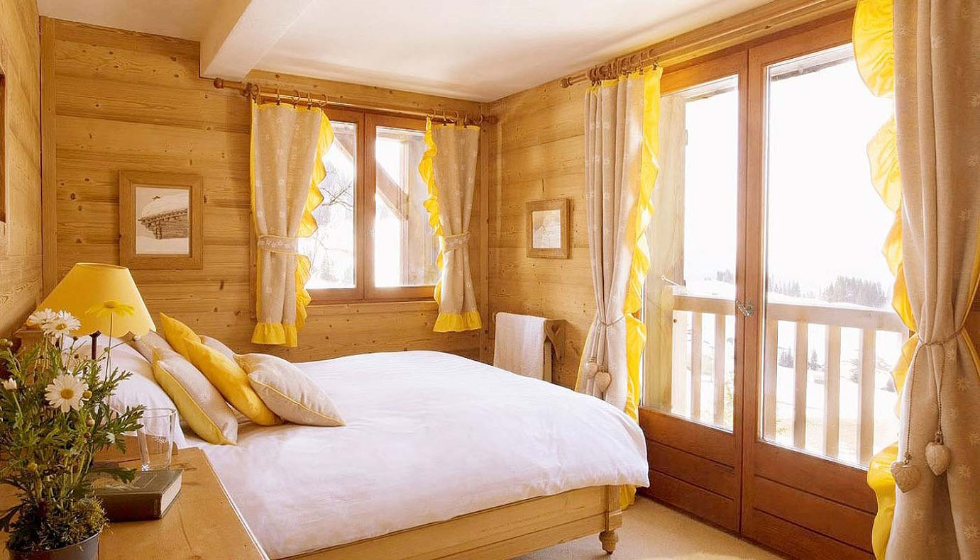 Interior of a bedroom in a wooden house