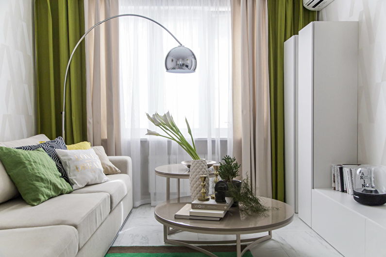 Combined curtains in the interior of a small living room