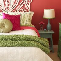Red wall in bedroom interior