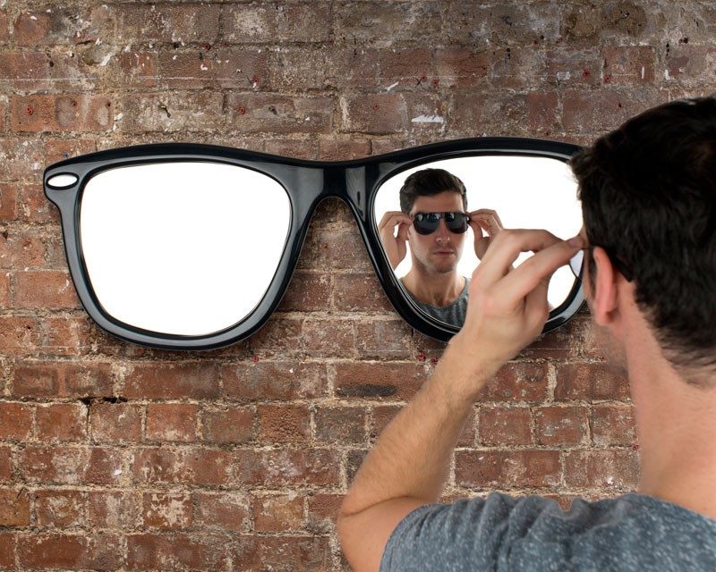 Mirror-glasses on the wall of the room in the loft style