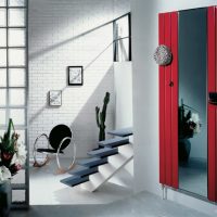 Mirror in the design of the hallway with stairs