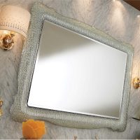A small mirror in a beautiful frame