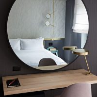 Large mirror on the black wall