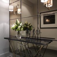 Large-format mirror tiles on the hallway wall