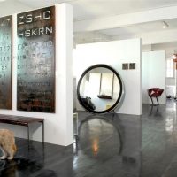 Large mirror in the interior of a loft style studio apartment