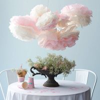 Crumpled paper flowers over a dining table