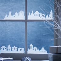 Decorating windows with paper houses