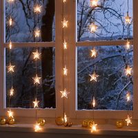 A garland of stars on the evening window