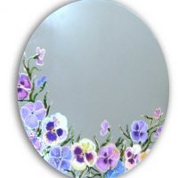 Drawings of flowers on an oval mirror