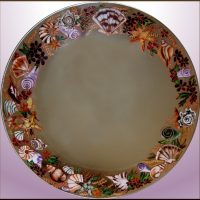 Painted seashells on a round mirror
