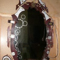 The original frame of the wall mirror