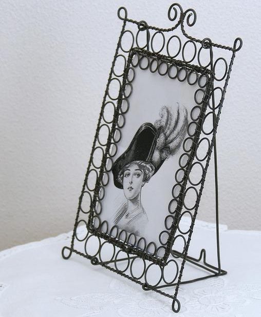 Girls in a hat in a wire frame