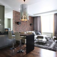 Brick accent wall in the kitchen-living room