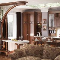 Design of a classic kitchen-living room with wooden furniture