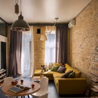 Imitation of a brick wall in the design of the apartment