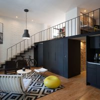 Black cabinets in a loft style apartment