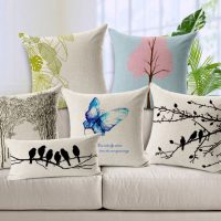 Embroidery on gray decorative pillows