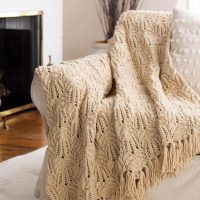 Knitted shawl on the back of the sofa