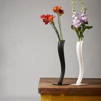 Stylish vases on an old table