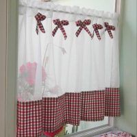 Checkered bows on the kitchen curtain