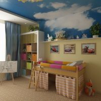 Wall mural with clouds on the ceiling of a children's room