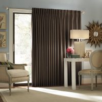 Beige furniture and brown curtains.