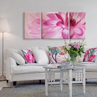 Pink flower over white sofa
