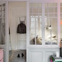 Glazed wooden partition in the bedroom